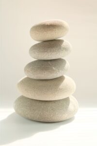 A photo of stones stacked one upon the other in perfect balance represent the balance you can achieve in your relationship through proper affair recovery. Healing from Infidelity program in the United States can help spouses heal and rebalance their relationship after infidelity. Schedule a consultation with Relationship Experts today.
