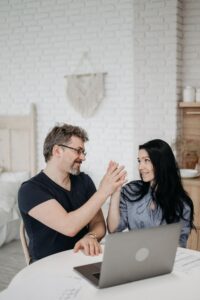 Couple using a mutual high five to represent their success in rebuilding their relationship after infidelity. Affair recovery experts in the United States can help a spouse in the aftermath of infidelity heal and rebuild trust. Schedule a free consultation with Relationship Experts in the United Stated, Canada, or the UK today. 