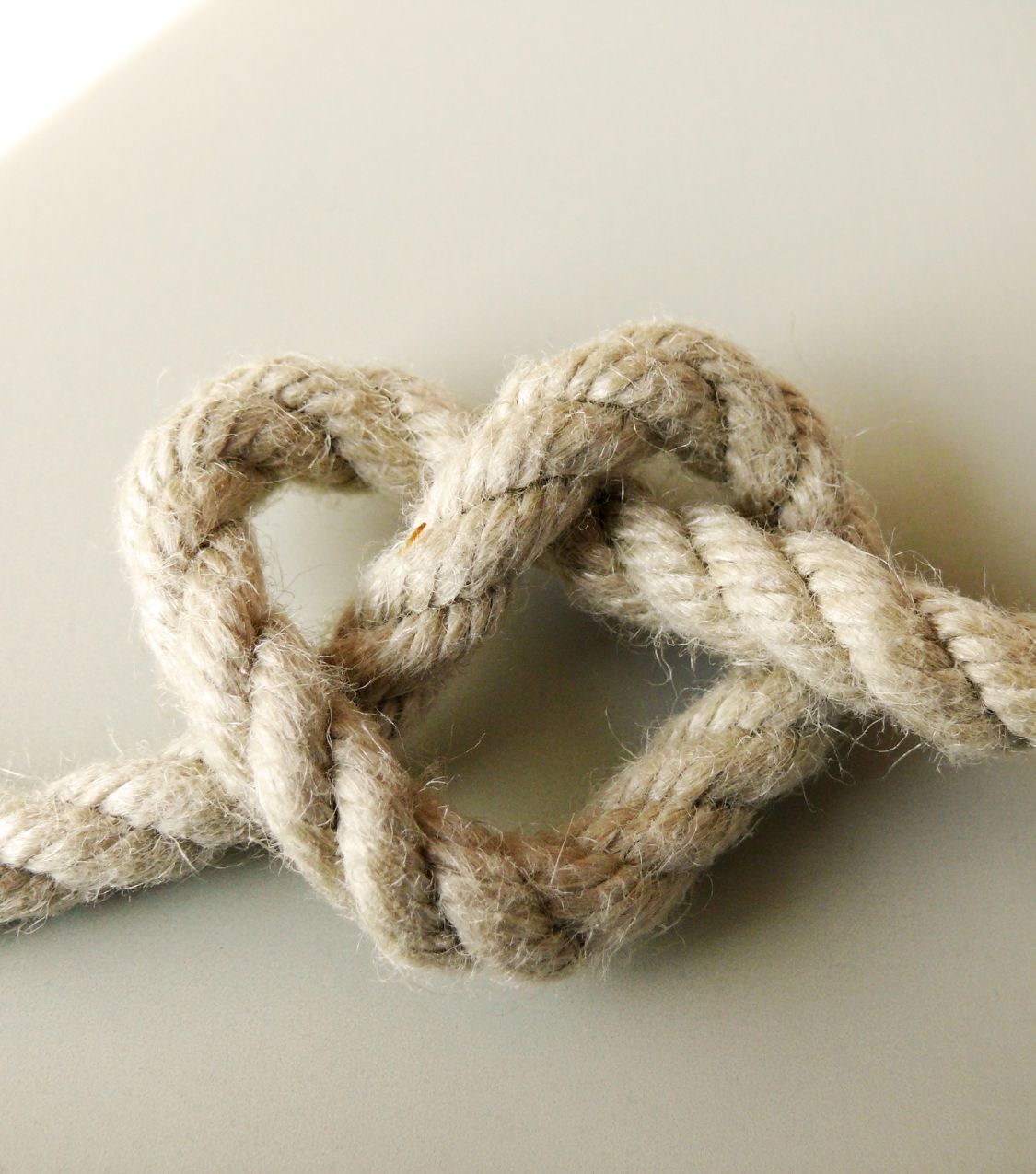 A rope tied in the shape of a heart is like the tie between love and betrayal. Showing the essence of betrayal trauma and true love. If you are suffering from betrayal trauma, contact our Relationship Experts for help today.