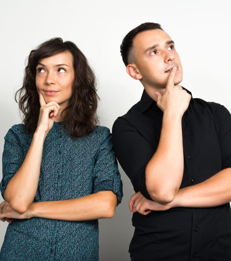 A woman and a man holing their chins suggesting they are wondering how long recovering after infidelity will take. If you are in the aftermath of infidelity you can benefit from affair recovery program by Relationship Experts in the United States and Canada