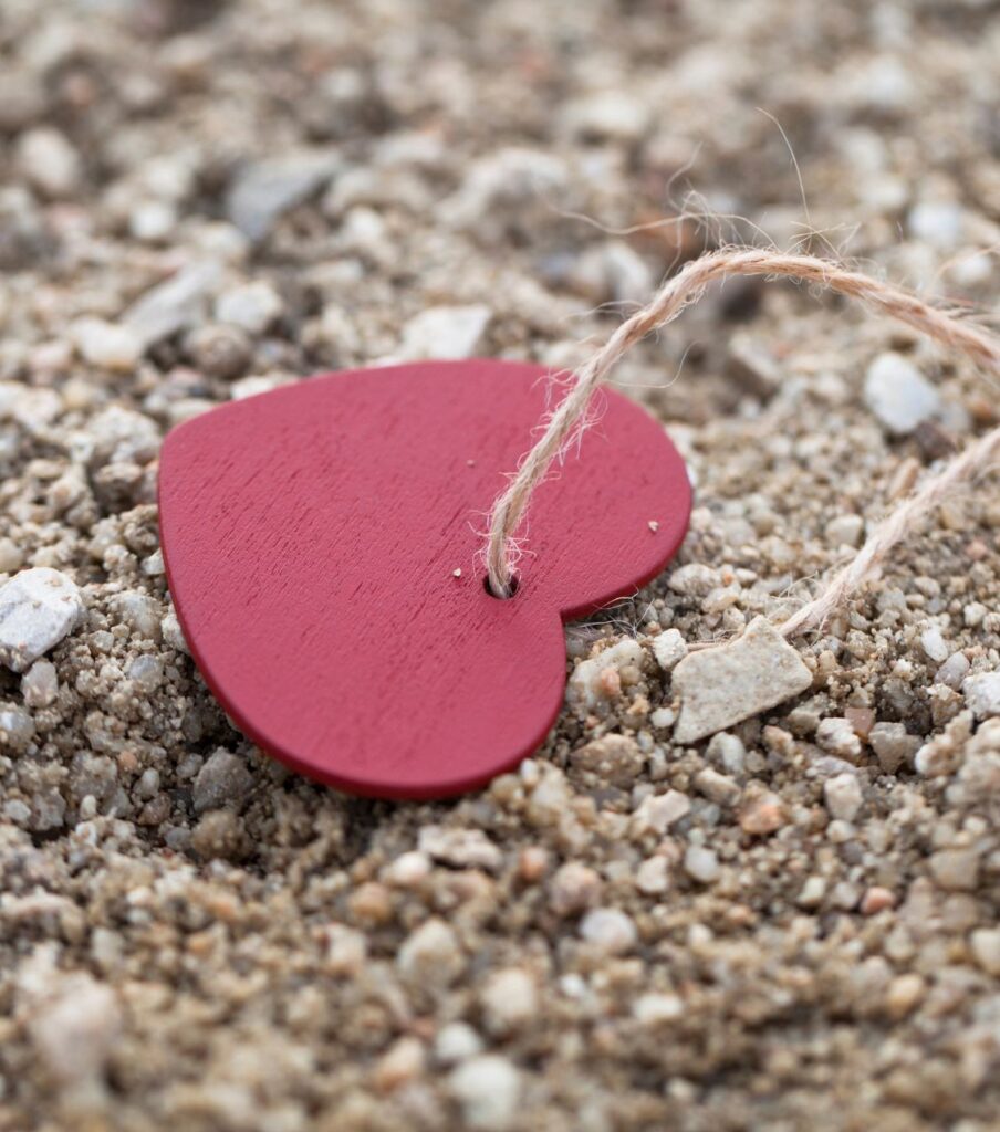 An image of a heart on the ground, symbolizing the profound impact of an affair crisis on both partners. Discover the healing power of a rescue plan through affair recovery counseling. Our Relationship Experts and therapists offer support in the United States, Canada, United Kingdom, and globally. Contact us for compassionate assistance today!