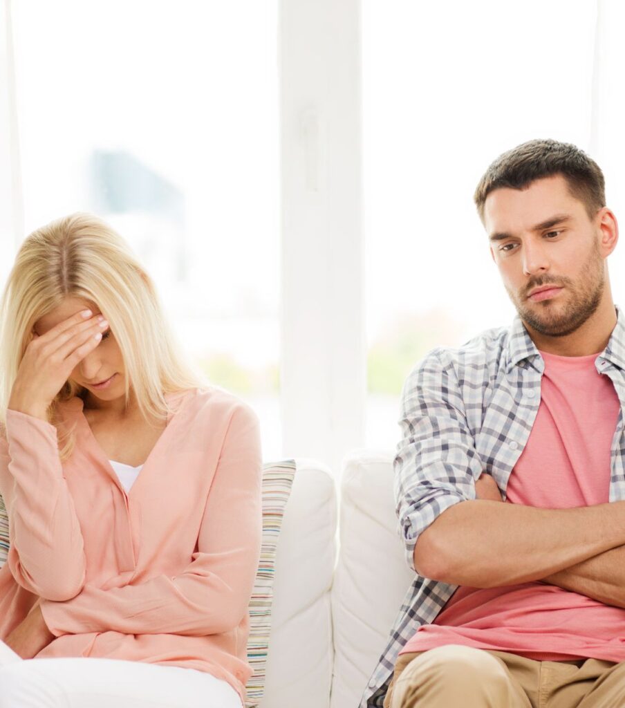 A woman sits next to a man, her hand on her forehead, symbolizing lost truth & honesty after the affair. Relationship Experts can assist. Schedule a consultation today. Serving couples globally, including California, North Carolina, Florida, Colorado, New York, Ohio in the USA, Canada, and the United Kingdom.