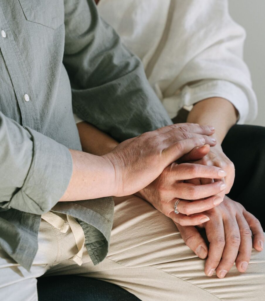 A couple holding hands, representing unity despite experiencing mutual infidelity. Our services extend globally, including Canada, the United Kingdom, and the United States. Read on to learn more about how we can assist you.