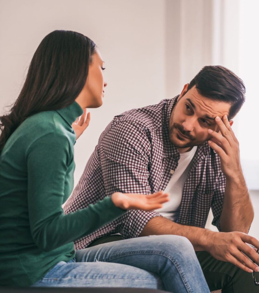 A couple discussing their relationship. Trickle truth delays true reconciliation, emphasizing the importance of full disclosure for affair recovery. Relationship experts available for consultations in New York and California in the United States, and globally.