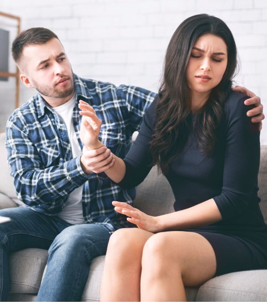 A woman avoiding a man's hug, showing the need to know how to apologize after cheating to avoid common mistakes. Get back together with help from our therapists in Florida, California, New York, and globally.