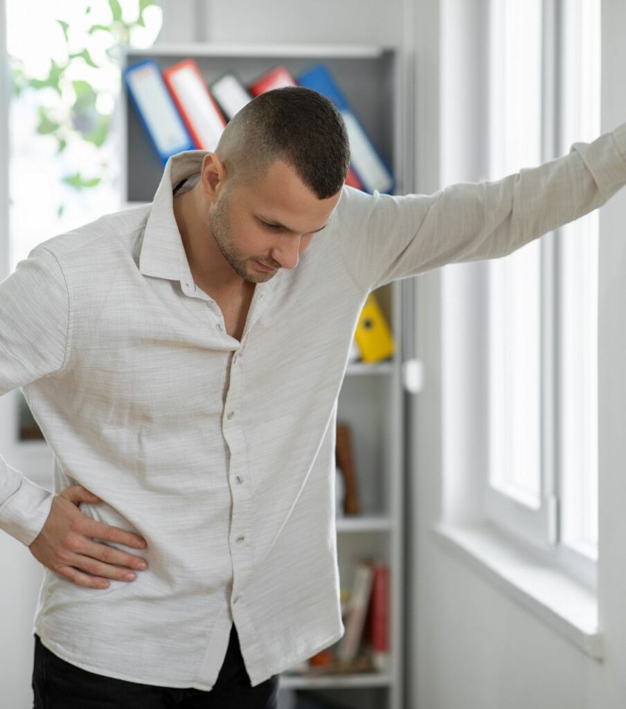 A man leans on a wall with his head bowed, symbolizing the emotional struggle of ending an affair. Seek guidance to move forward with relationship experts support in the US and globally.
