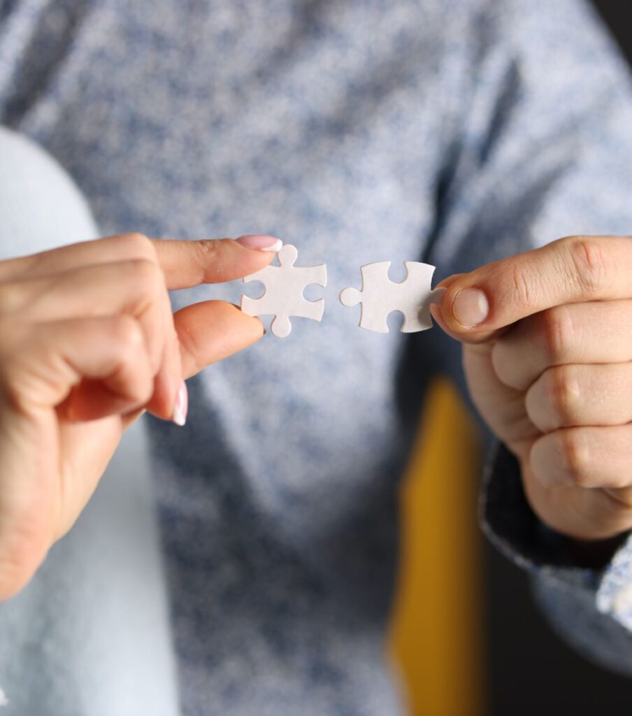 A couple holding puzzle pieces, symbolizing how to regain trust after cheating and the journey of healing after infidelity with expert support in USA, in Canada, in the United Kingdom and worldwide.

