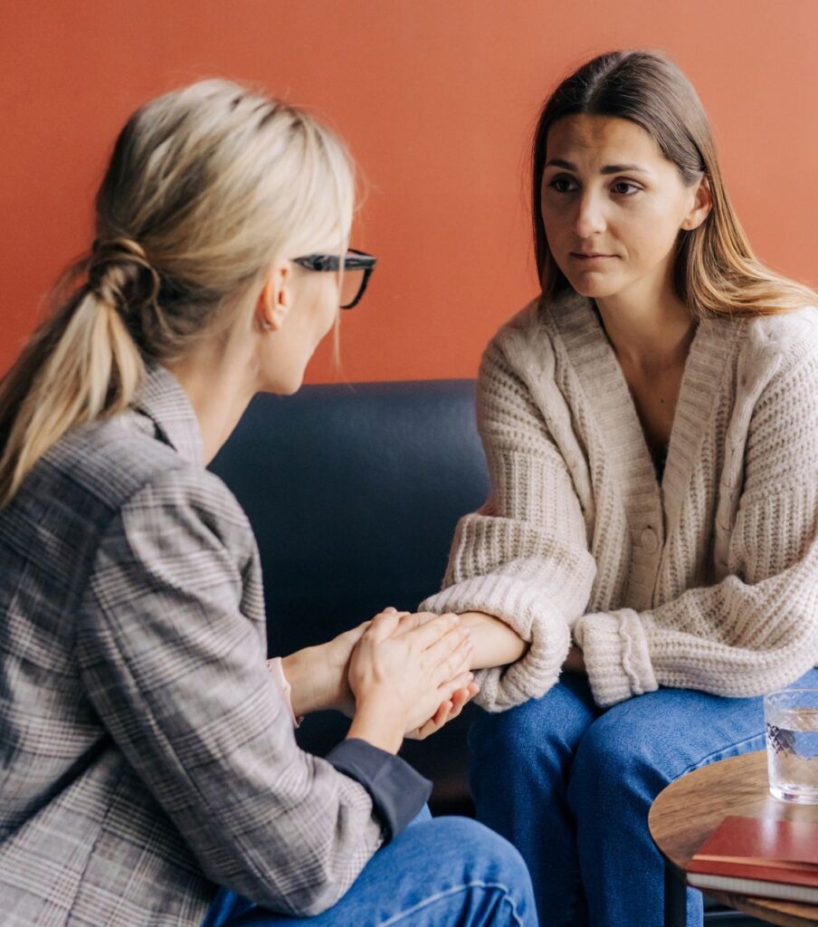 A compassionate woman offering support to another distressed woman. An affair recovery expert provides relationship recovery coaching to help couples navigate betrayal, rebuild trust, and achieve complete healing from infidelity in Florida, across the United States, Canada, and worldwide.

