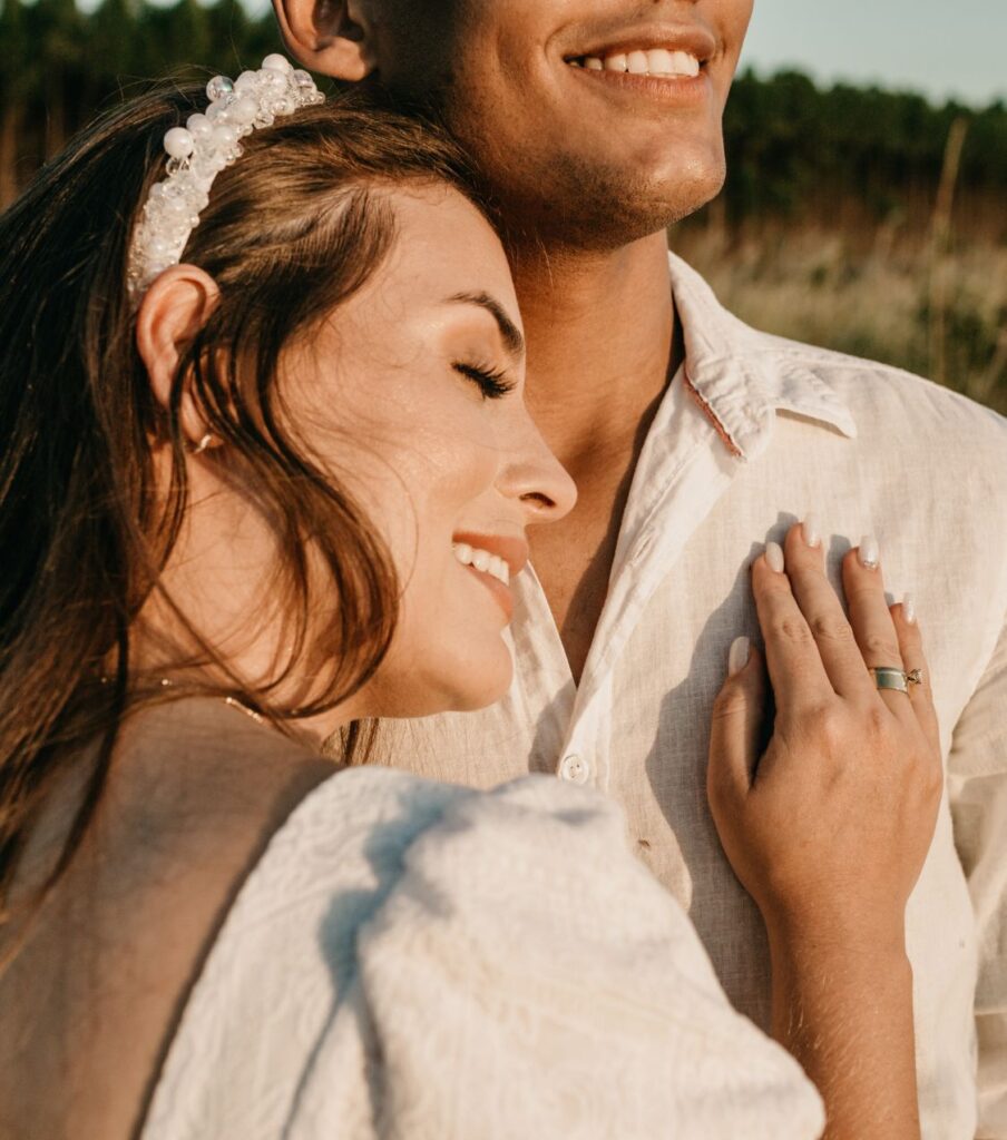 Smiling woman leaning on a man | Forgiveness after infidelity in the United States | Surviving infidelity in the UK | in Canada Smiling woman leaning on a man's chest, representing hope and emotional healing through forgiveness after infidelity. Get expert guidance on surviving infidelity in the USA, Canada, and the UK.