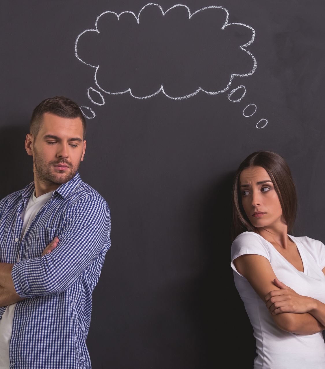 Man and woman standing back to back, symbolizing emotional distance while exploring surviving infidelity and forgiveness. Relationship experts in the US, United Kingdom, and Canada offer guidance on rebuilding trust and healing.
