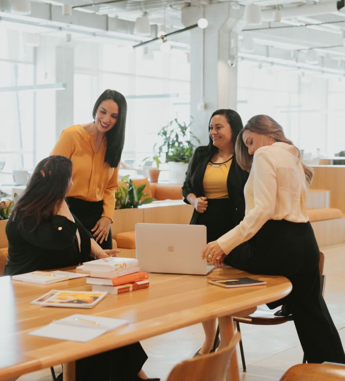 Four women chatting in an office | Best infidelity recovery program in the USA | Heal after an affair in the US | Canada | The UK Four women chatting in an office, symbolizing professional support. Offering the best infidelity recovery program to help couples heal after an affair in the US, Canada, the UK, and worldwide. Schedule your free consultation today.