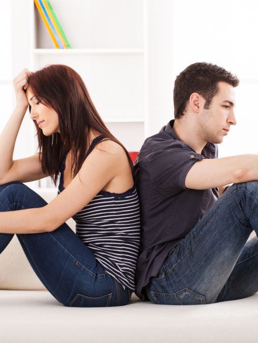 A couple sits back to back | Rebuild trust after cheating in the USA | How to rebuild trust after betrayal in marriage in Canada | Marriage therapists in the UK A couple sits back to back, showing distance after betrayal. Rebuild trust after cheating with expert guidance. Schedule a consultation today. Supporting couples in the USA, Canada, England, and globally.
