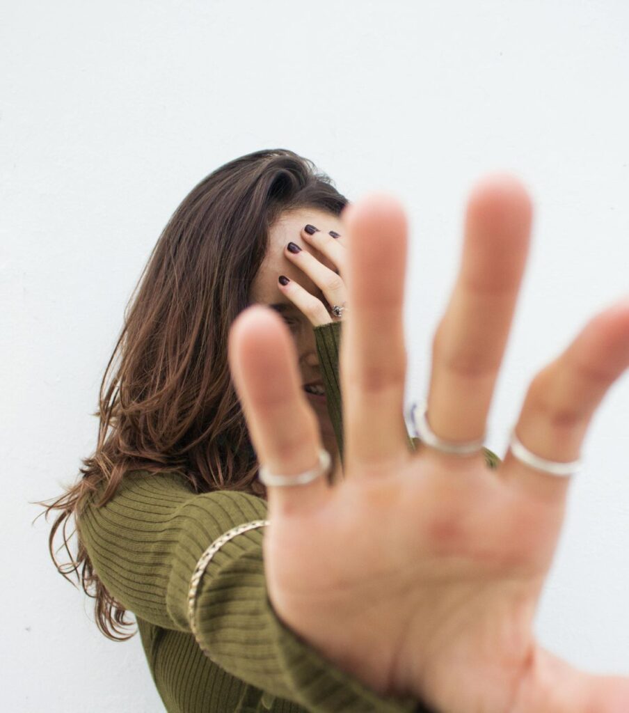 A woman hiding her face with her hand | Healing after public infidelity in the USA | Canada | the Uk A woman hiding her face with her hand. Healing after public infidelity in the USA, Canada, the Uk and worldwide with an expert help. Schedule a free consultation with us today.