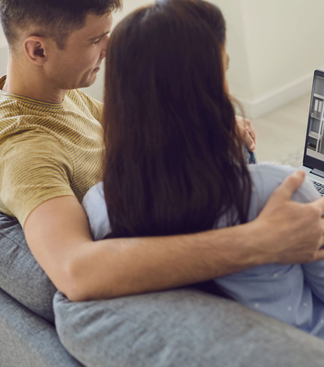 Couple sitting and hugging while looking at a laptop | Infidelity counseling for unsure couples in the USA | Starting healing after cheating in Canada | Affair recovery help in the UK Couple sitting and hugging while looking at a laptop. Infidelity counseling for unsure couples can help them start healing after cheating. Supporting couples in the USA, Canada, the UK, and worldwide with Relationship Experts.