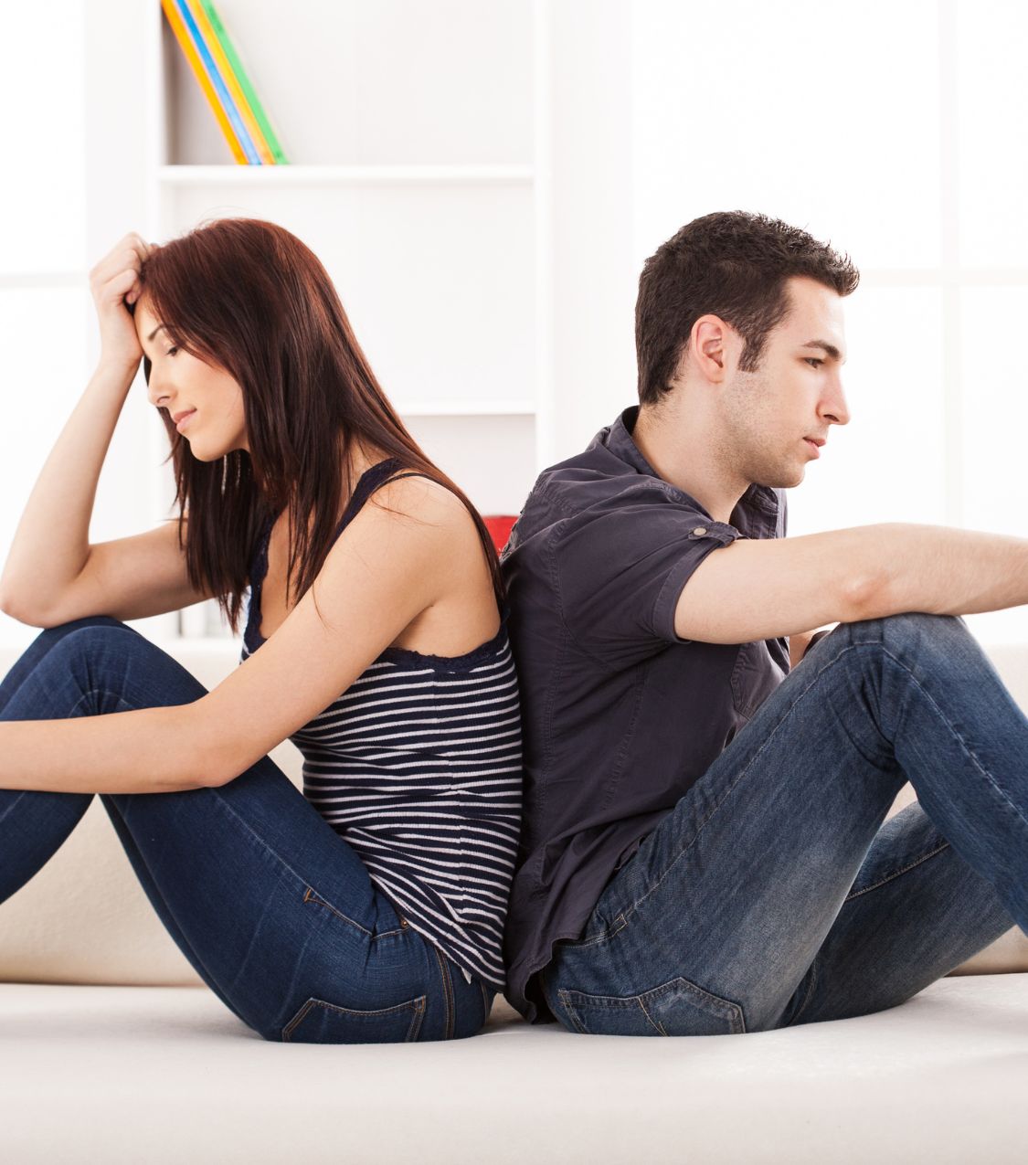 Woman and man sitting back to back | How to heal after betrayal in the United States | Infidelity recovery without staying in the UK | Should I start therapy after infidelity in Canada Woman and man sitting back to back. Discover how to heal after betrayal and begin infidelity recovery without staying. Schedule a free call in the USA, Canada, the UK, and globally.