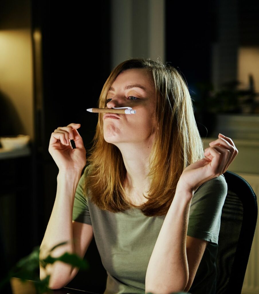 A woman sits at a desk, pen balanced between her mouth and nose, unable to control racing thoughts. Mistakes after infidelity can be fixed. Learn what to avoid after cheating with help from relationship experts in the United States, Canada, the UK, and globally. Schedule a call today.