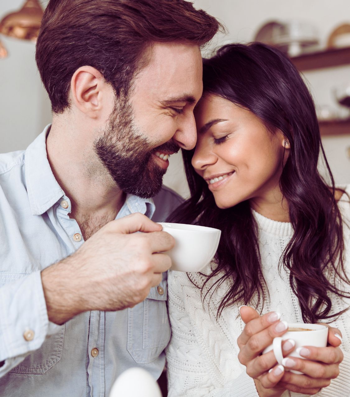 A couple reconnecting after betrayal, representing the journey to heal from an affair and rebuild trust after an affair for American couples and for couples in Canada, Dubai, the UK, Australia, and globally. Schedule a free consultation with us today!